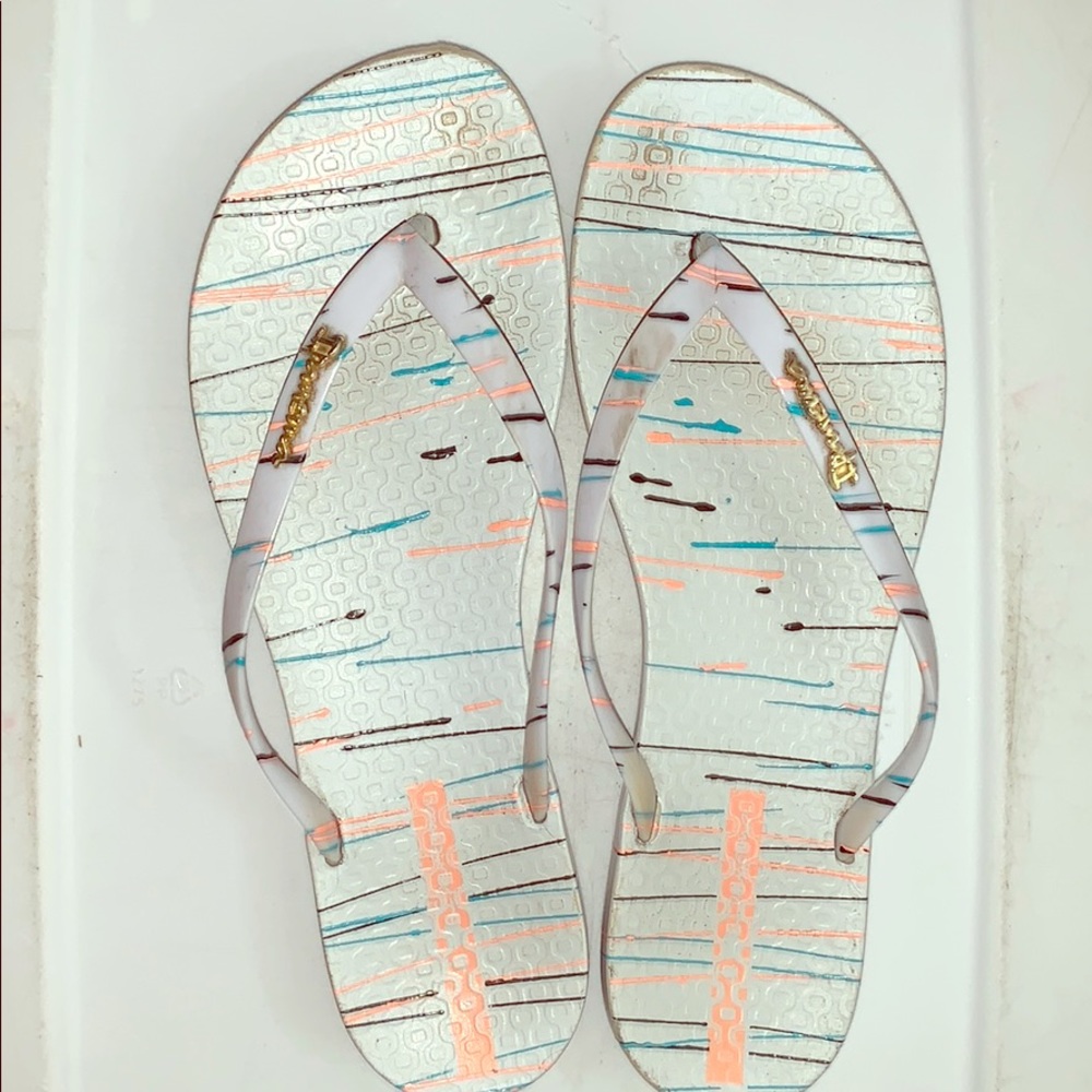 Some nice sandals colorful paint splattered.